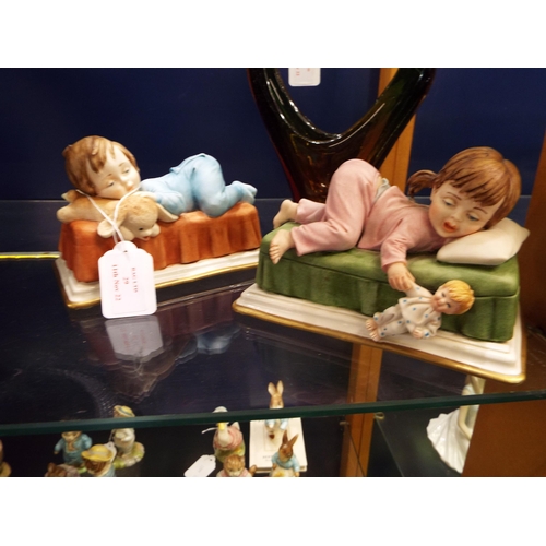 29 - Two Capodimonte figurines depicting sleeping children