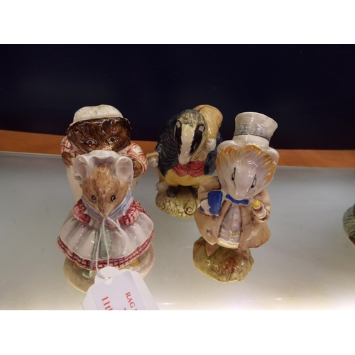 39 - Four Beswick Beatrix Potter figurines to include 'Mrs Tiggy Winkle', 'The Old Woman Who Lived in a S... 