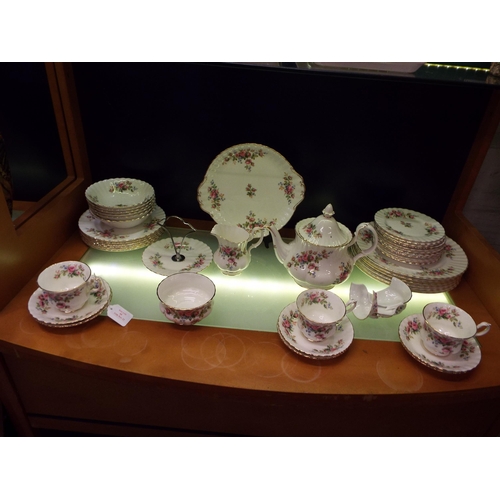 60 - A Royal Albert 'Moss Rose' dinner and tea ware to include dinner plates, side plates, tea pot, cream... 