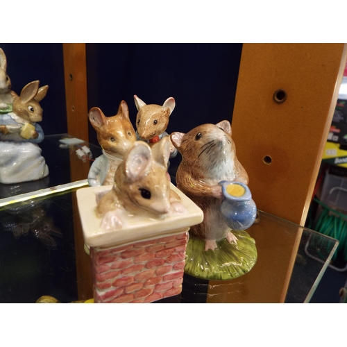 8 - Four Beswick Beatrix Potter figurines to include 'Tom Thumb', 'Johnny Town-Mouse Eating Corn', 'John... 