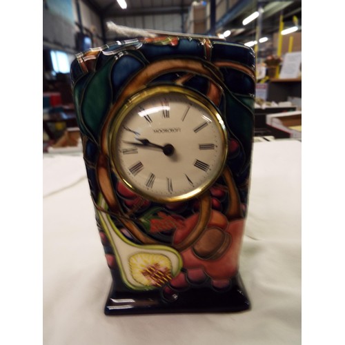 5 - A 2000 Moorcroft Quartz clock 'Queens Choice' designed by Emma Bossons, signed to base 6 1/4