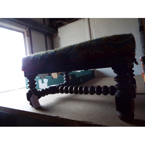 375 - A Victorian oak bobbin turned foot stool with dragon decoration