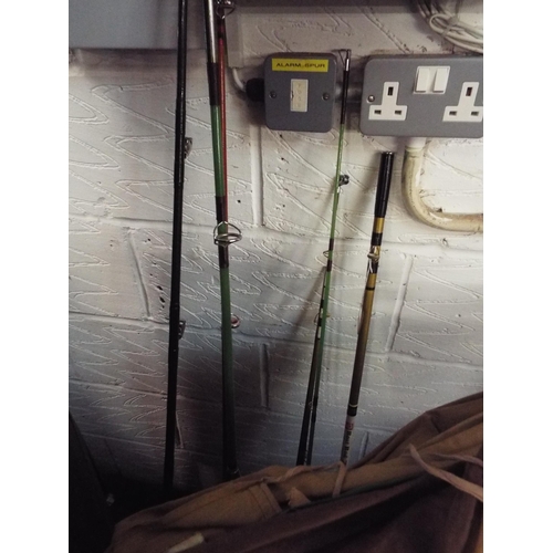 557 - An Olympic Boat Rod No 70, a Modern Art Company fishing rod, and four other fishing rods and dust co... 