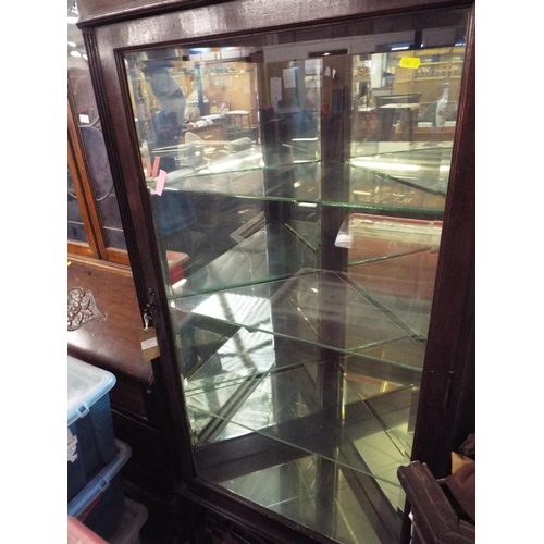 559 - A Victorian oak mirror back corner cabinet with three glass shelves