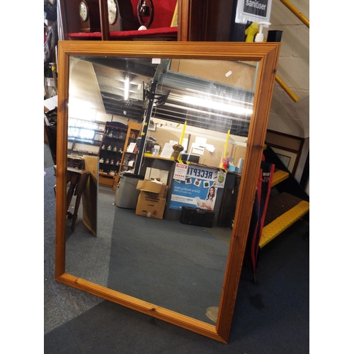 560 - A large pine framed mirror