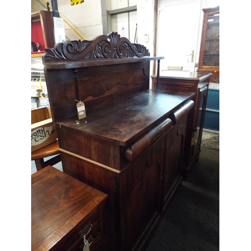 567 - An early Victorian rosewood chiffonier having turned pillars supporting a gallery shelf above two fr... 