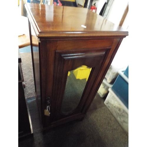 568 - A Victorian mahogany bevel mirror door music cabinet with two internal shelves