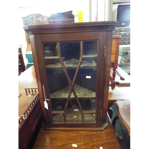 574 - A mahogany small hanging corner cupboard with glazed door