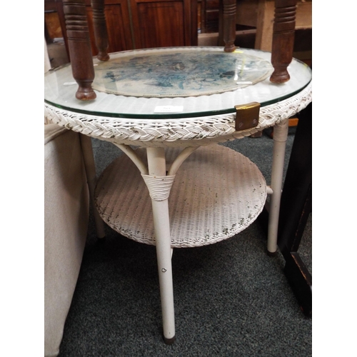 587 - A white painted wicker side table with glass top