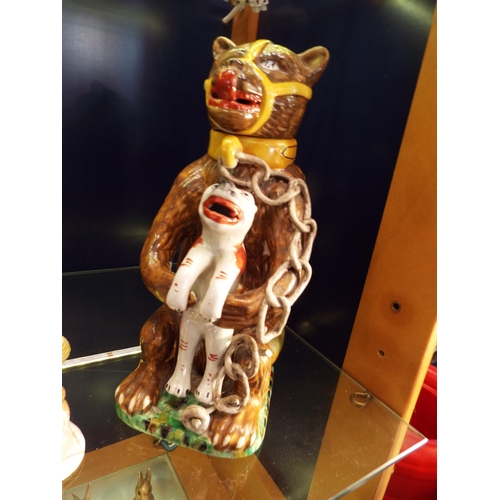 14 - A reproduction Majolica bear grease jug (damage to chain)