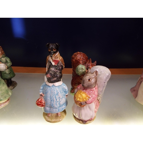 20 - Four Beswick Beatrix Potter figurines to include 'Pig Wig', 'Squirrel Nutkin', 'Pickles' and 'Goody ... 