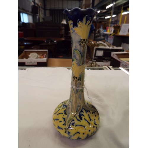 25 - A 1902 J.S. McIntyre Moorcroft Florian ware bud vase with scallop rim blue green and yellow designs,... 