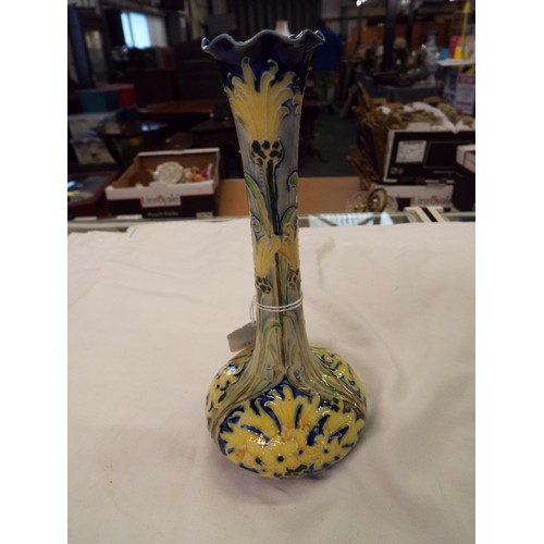 25 - A 1902 J.S. McIntyre Moorcroft Florian ware bud vase with scallop rim blue green and yellow designs,... 