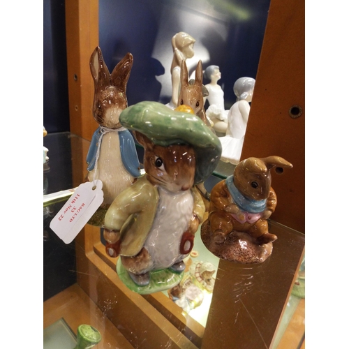 33 - Four Beswick Beatrix Potter figurines to include 'Old Mr Bouncer', 'Peter Rabbit Gardening', 'Benjam... 