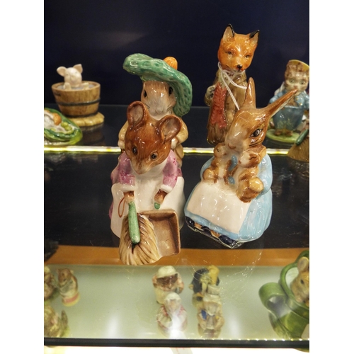 35 - Four Beswick Beatrix Potter figurines to include 'Mr Tod', 'Mrs Rabbit and Bunnies', 'Benjamin Bunny... 