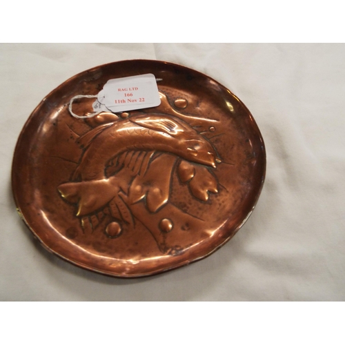 166 - A copper arts and crafts dish with a fish design stamped Newlyn