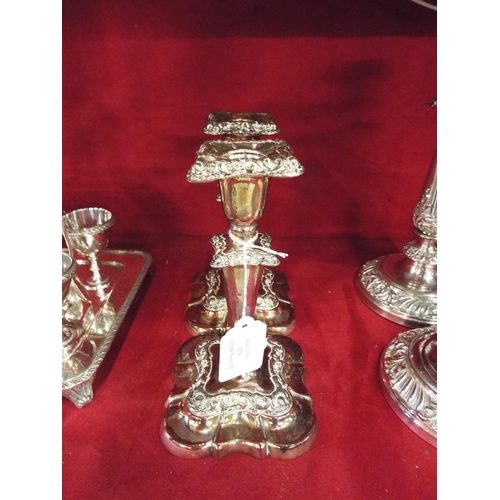 276 - A pair of Victorian Sheffield plated candlesticks 7