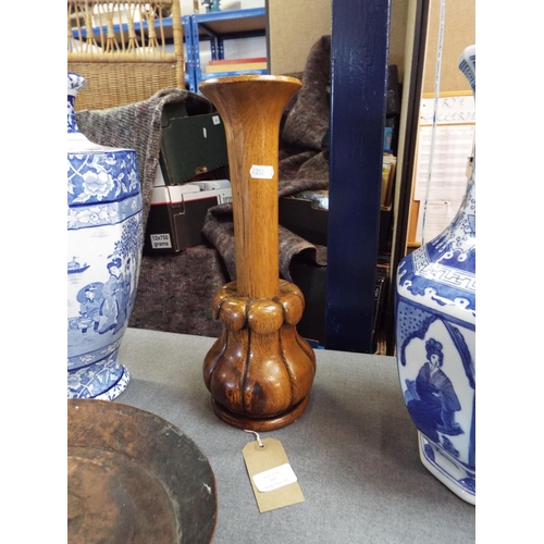 285 - A carved wooden vase