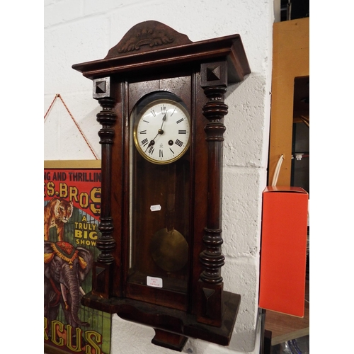 351 - An oak cased wall hanging clock