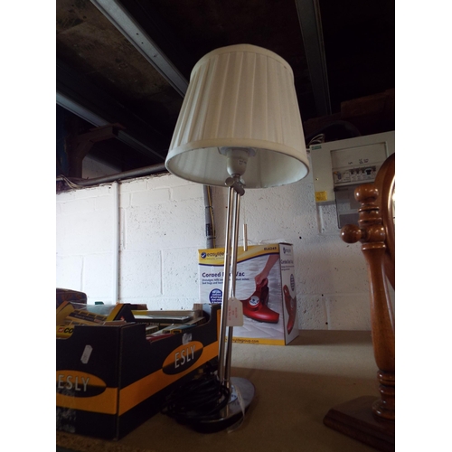 373 - A brushed steel table lamp with pull chord and cream shade