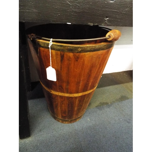 402 - A large wooden log pail with swing handle