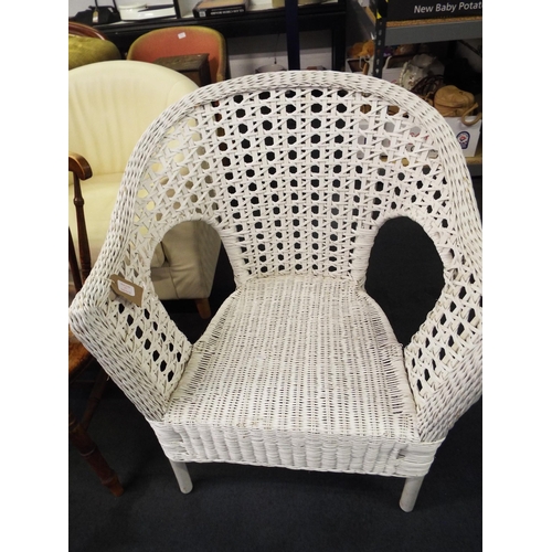 477 - A white wicker chair