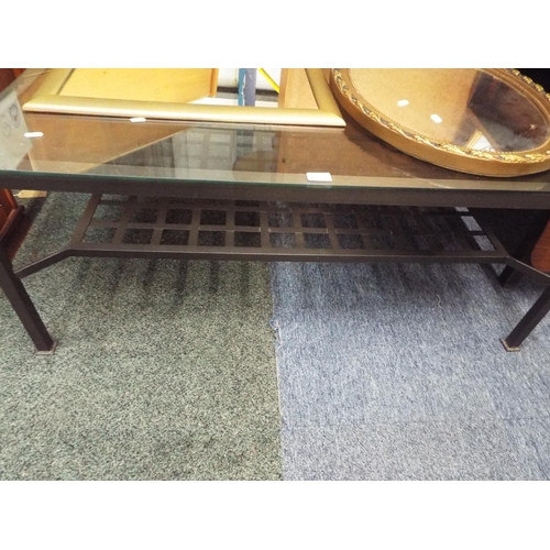 495 - A glass top and steel coffee table with under tier