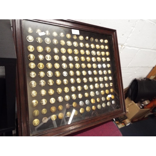 127 - A mounted framed and glazed selection of assorted military buttons