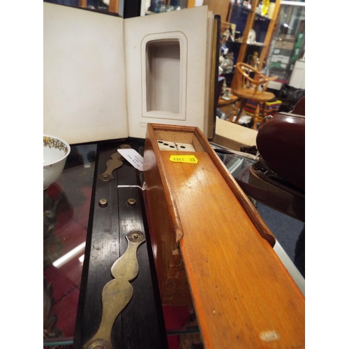 139 - A full set of dominoes together with a leather photograph album and an ebony and brass ruler