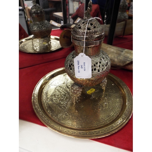 145 - A round brass Islamic tray together with an Islamic silver and copper potpourri vase and cover