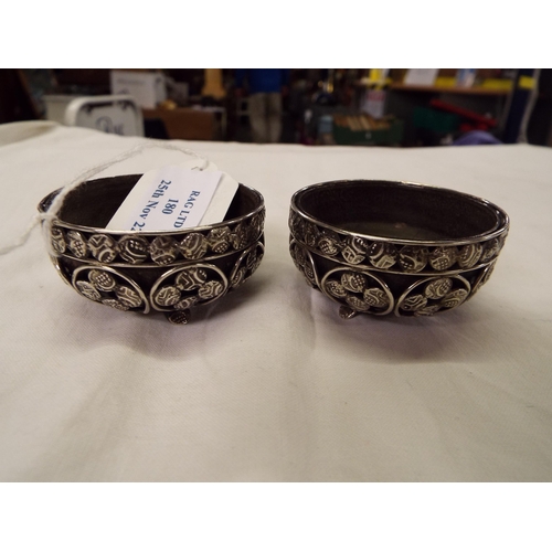 180 - A pair of Indian silver salts and horn liners