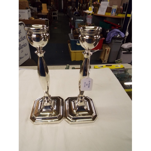 181 - A pair of 1936 London silver candlesticks, 10