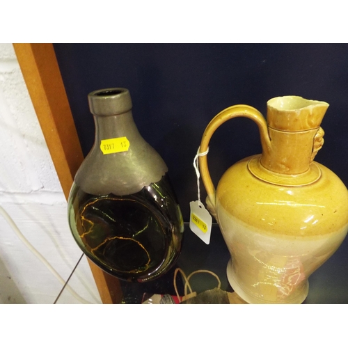 88 - A salt glazed pottery jug together with a pewter mounted green dimple bottle