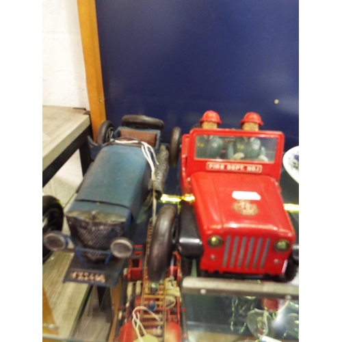 96 - A tin plate model of a vintage car and a Fire Dept No1 Jeep