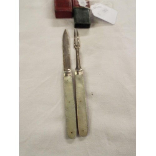 174 - A silver and mother of pearl fruit knife and similar fork in leather box