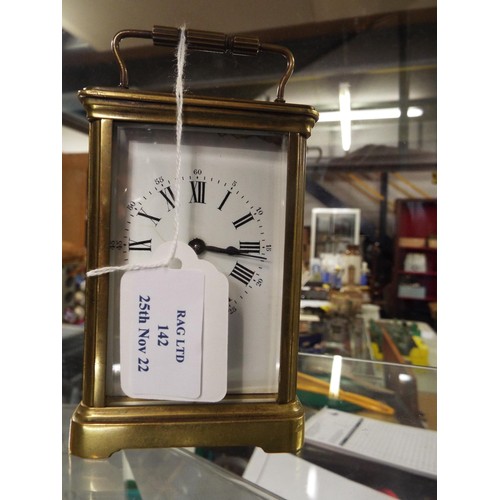 142 - A French glass and brass carriage clock for Benetfink & Co London