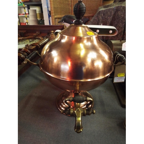 217 - A Victorian copper samovar with brass handles and tap