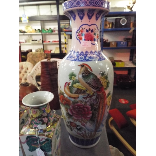 225 - A large Oriental style vase with floral and crane decoration