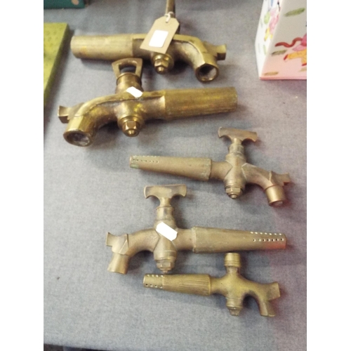 226 - Two pairs of heavy brass Breweriana taps and a single tap