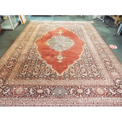 621 - A large Kerman Shah red ground rug with floral and leaf pattern 135