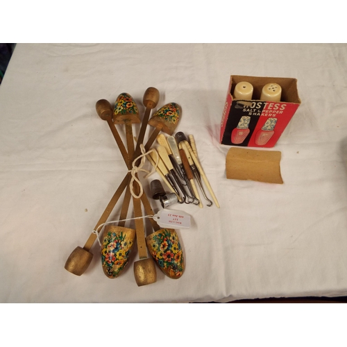 117 - Four decorative shoe stretchers, a salt and pepper and a selection of sewing tools