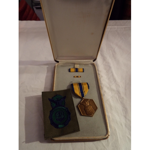 120 - A boxed American military Merit medal, ribbon and insignia