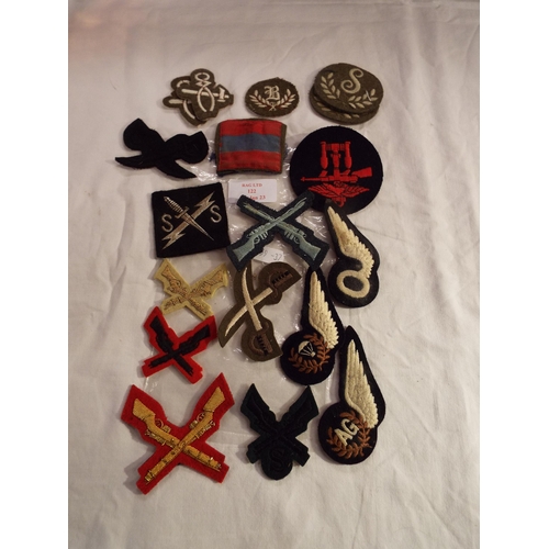 122 - A bag of assorted military cloth insignia