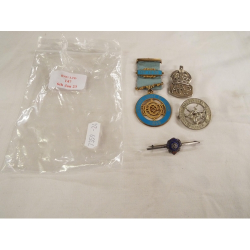 147 - A silver Masonic medal, silver A.R.P badge and two other badges