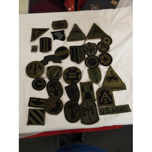 154 - A selection of USA Army combat survived insignia