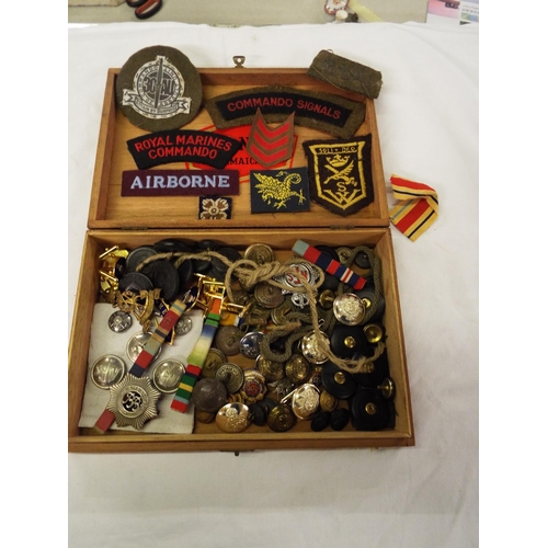 158 - A box of assorted military buttons, badges and insignia
