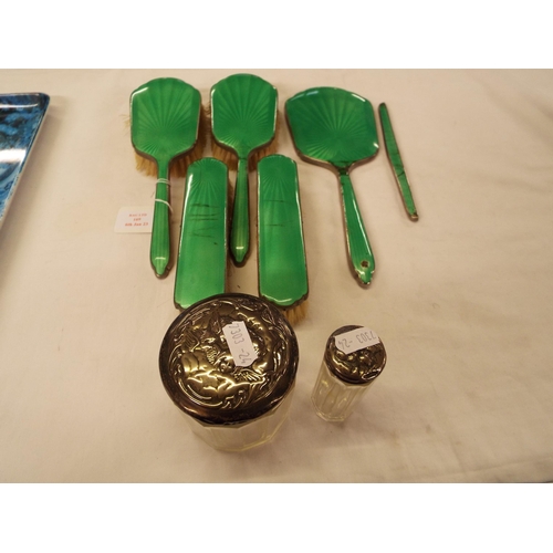 169 - Two silver top and glass dressing table jars and a silver-plated brush and mirror set