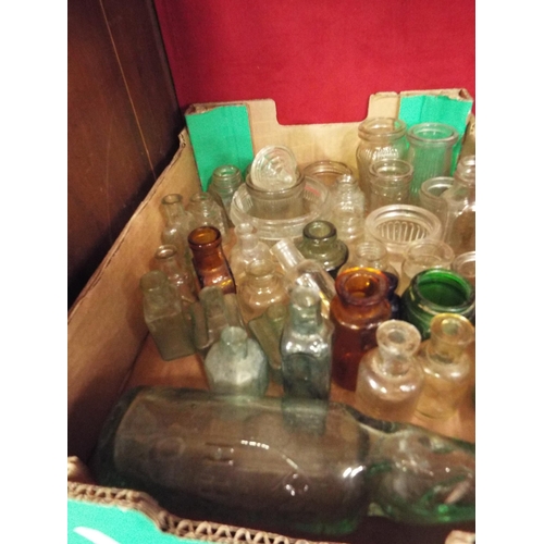 203 - A box of vintage glass bottles