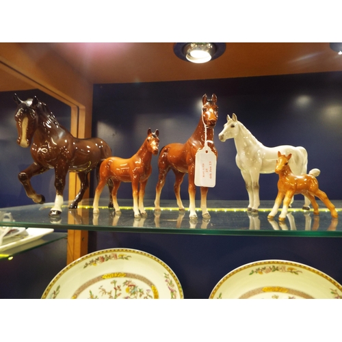 25 - A Beswick cantering horse (ear A/F) and four other horses