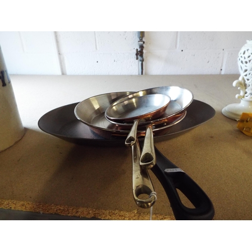 309 - Three brass and copper frying pans and a steel skillet